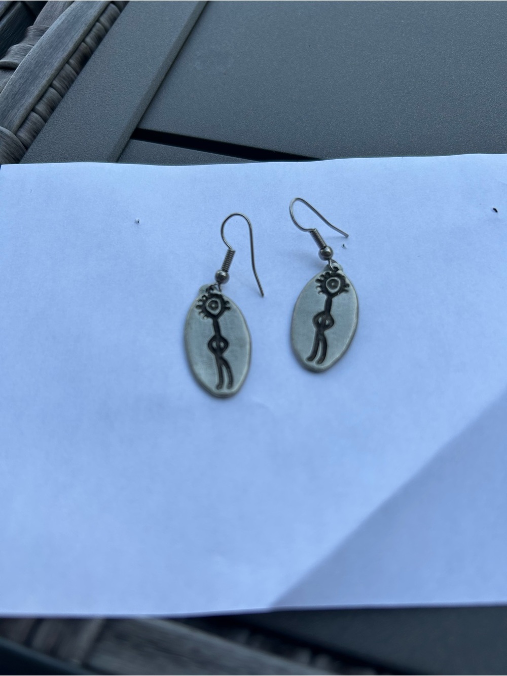 Southwest Inspired Silver-Toned Oval Dangle Earrings with Kokopelli Motif